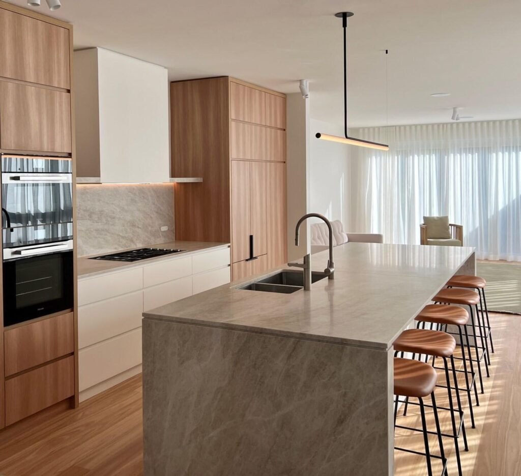 Taj Mahal countertops with white cabinets