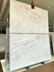 Taj Mahal quartzite kitchen with White cabinets