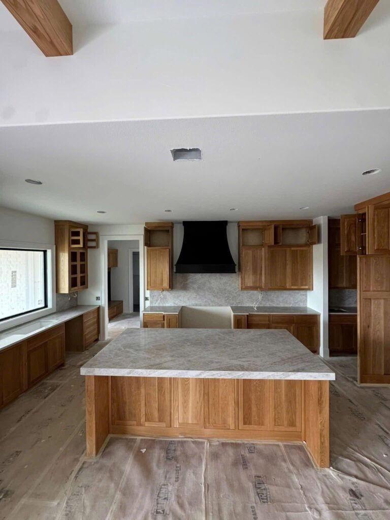 taj mahal quartzite kitchen with white cabinets