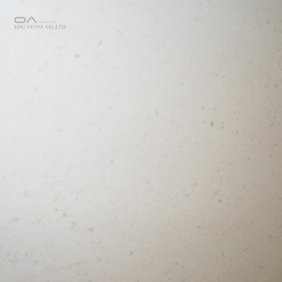 what causes white spots on marble